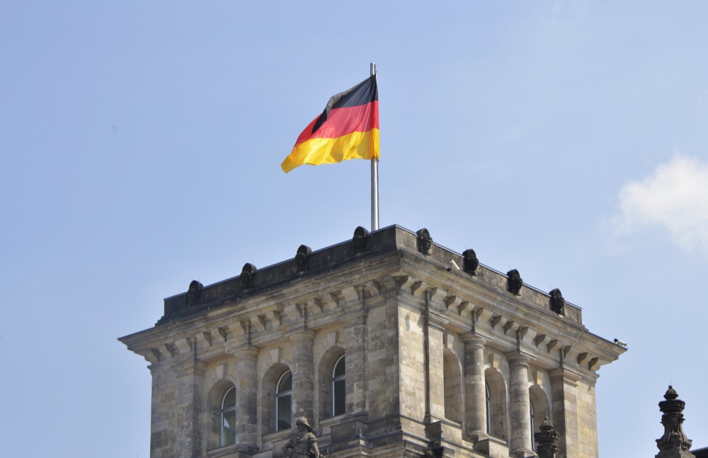 The German flag on top of the Reichstag, Berlin, Germany