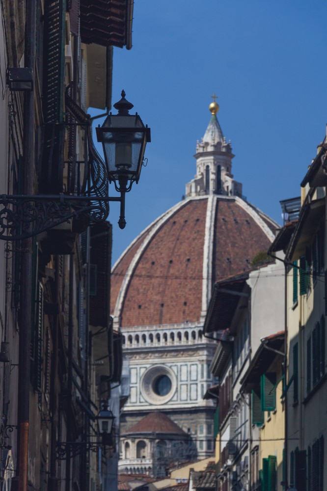 The dome of the Duomo can be seen peeking through in so many of the little old streets in Florence!